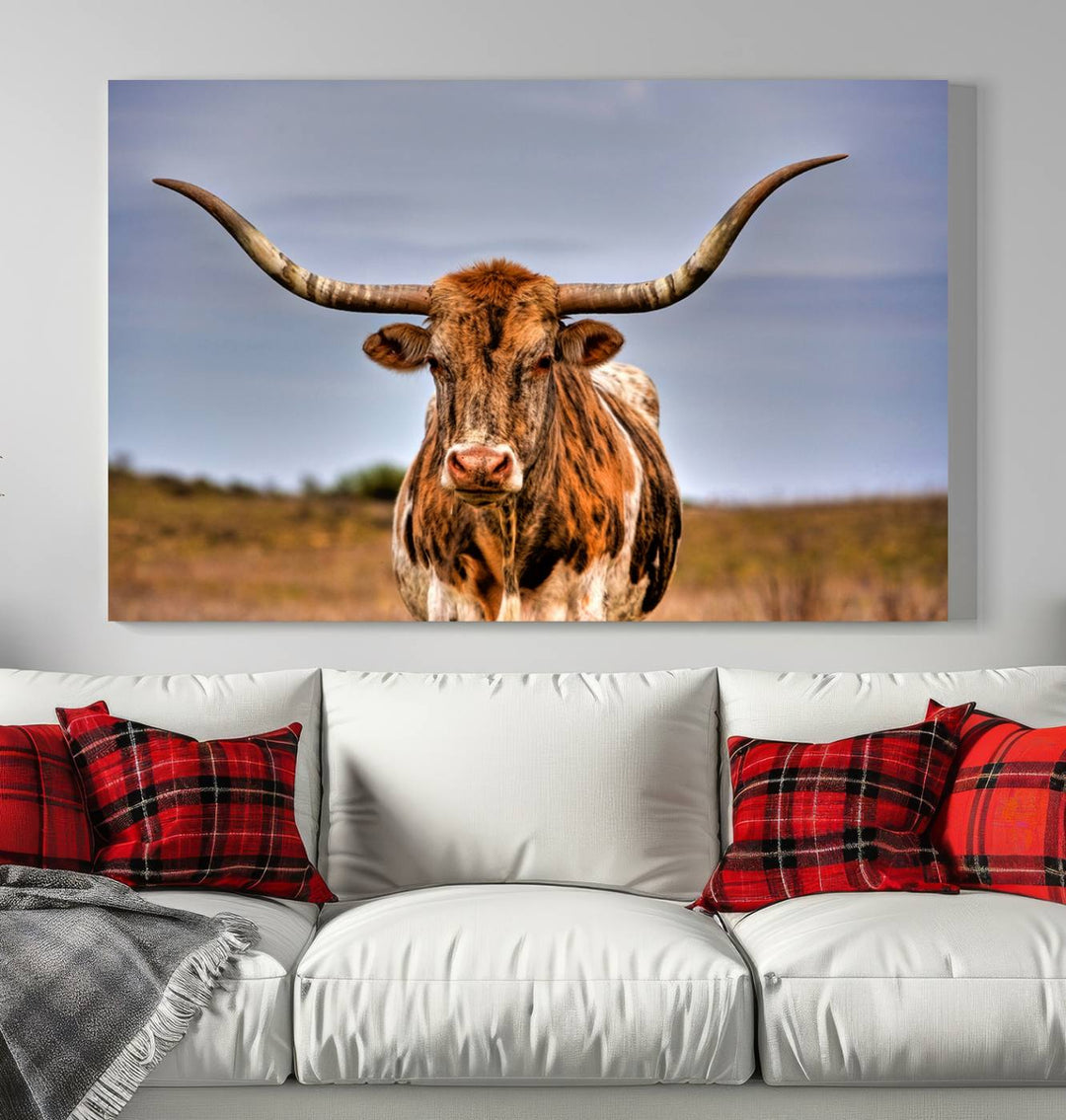 The Texas Longhorn Wall Art Print, a triptych canvas artwork depicting a longhorn bull in a field, features a gallery-quality finish.