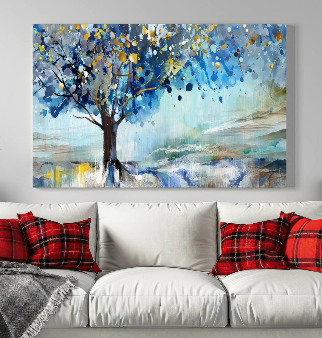 A modern living room features a three-panel Watercolor Style Abstract Tree Printing Wall Art Canvas in vibrant blue and yellow, crafted on museum-quality material.