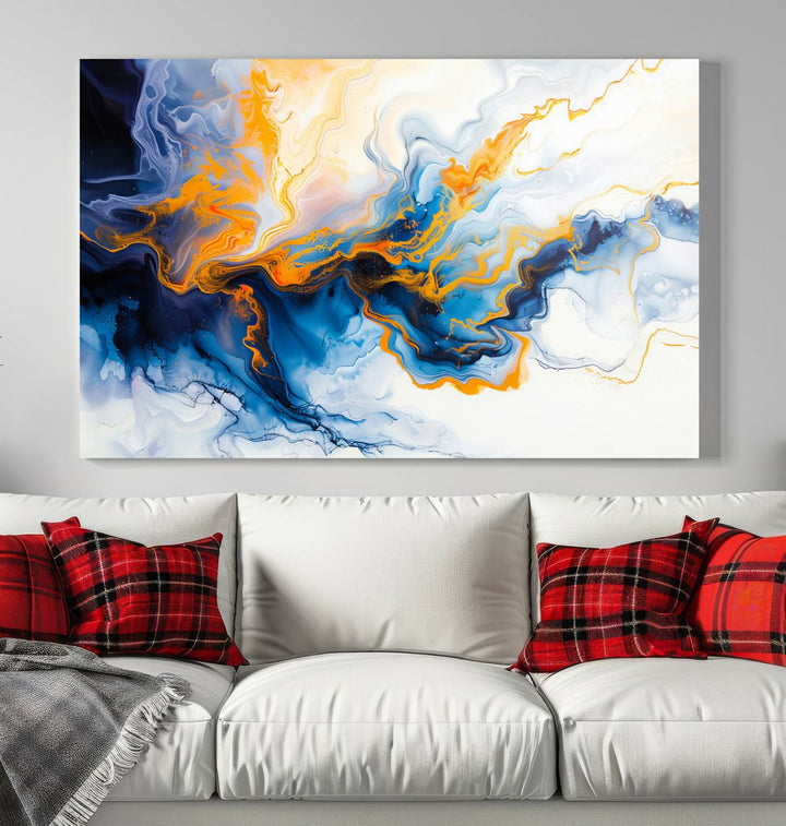 A stunning Fluid Alcohol Ink Wall Art with Gold Wall Art Canvas Print, featuring vibrant blue, orange, and white swirls, adorns the wall. This gallery-quality finish adds an exquisite touch to any living space.