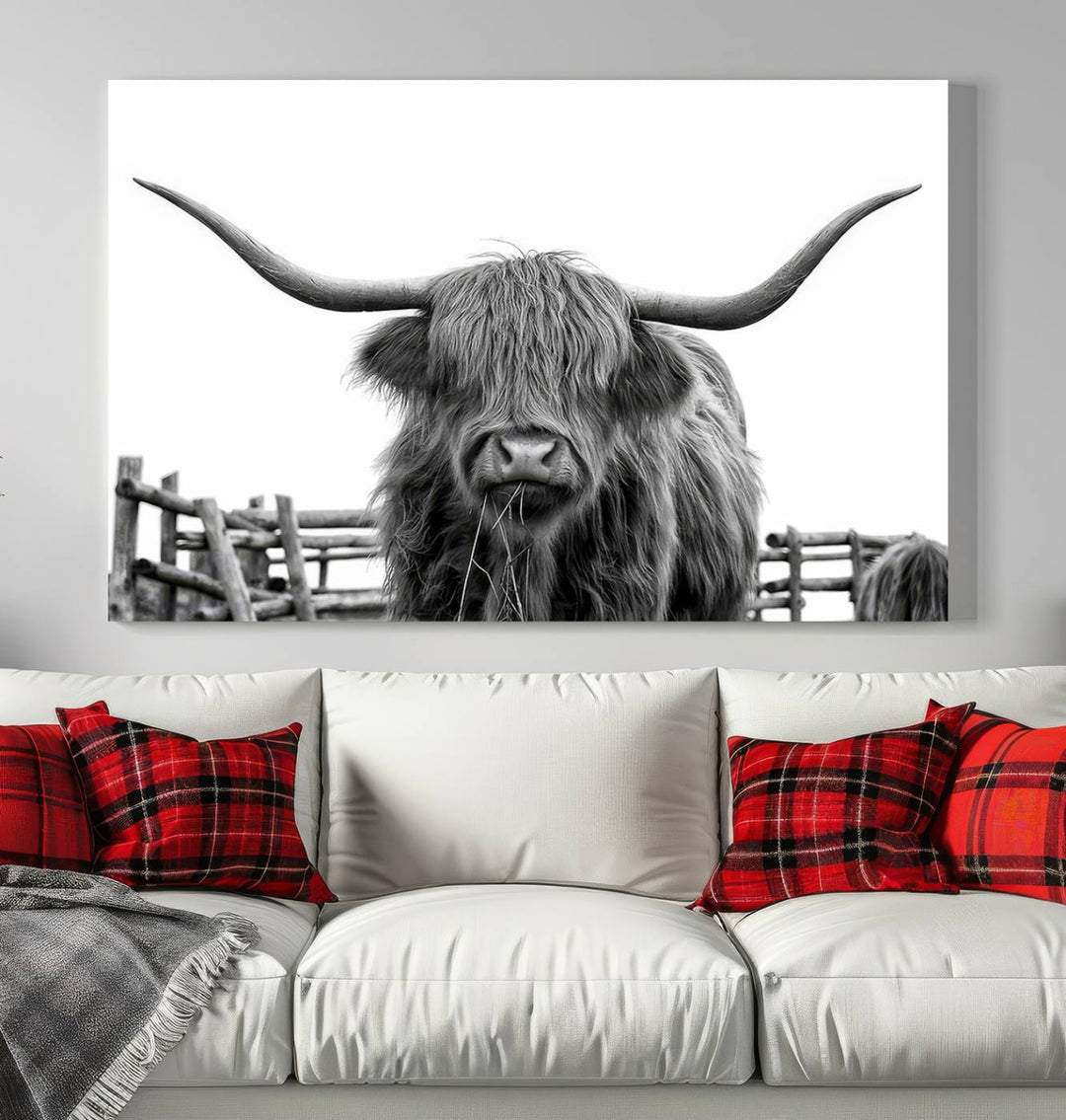 The Longhorn Canvas Print, featuring a black-and-white triptych of a Bighorn cow with shaggy fur and impressive long horns, is elegantly showcased. This wall art piece boasts a gallery-quality finish on premium canvas, bringing sophistication to any room.