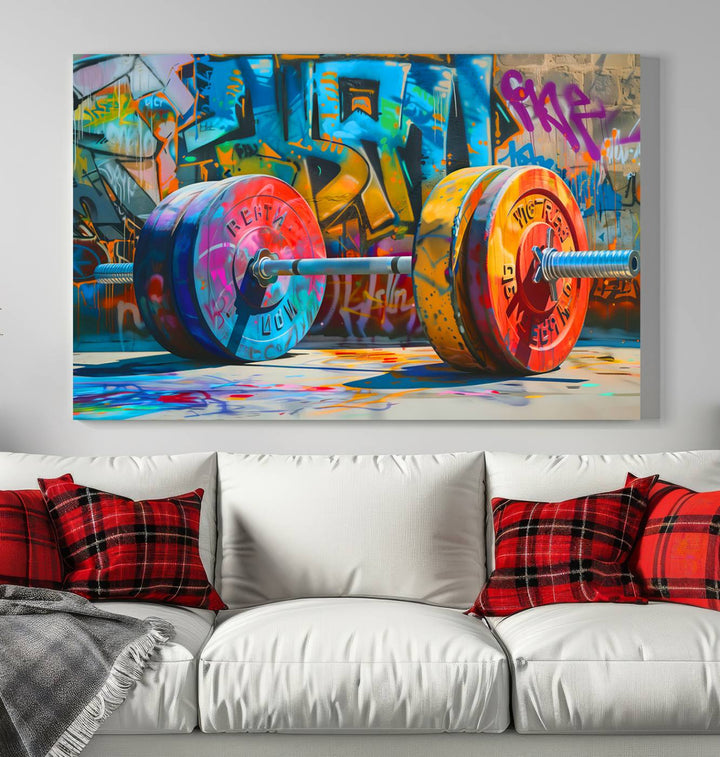 The Fitness Gym Barbell Graffiti Wall Art Canvas Print, a vibrant triptych featuring a barbell against a graffiti backdrop, elegantly hangs in the room. Crafted on premium canvas with a gallery-quality finish, this stunning piece of wall art effortlessly combines urban flair with sophisticated decor.