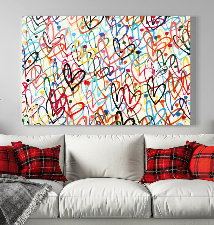 The "Colorful Love Canvas print," featuring vibrant abstract street art with overlapping loops, is handmade in the USA.