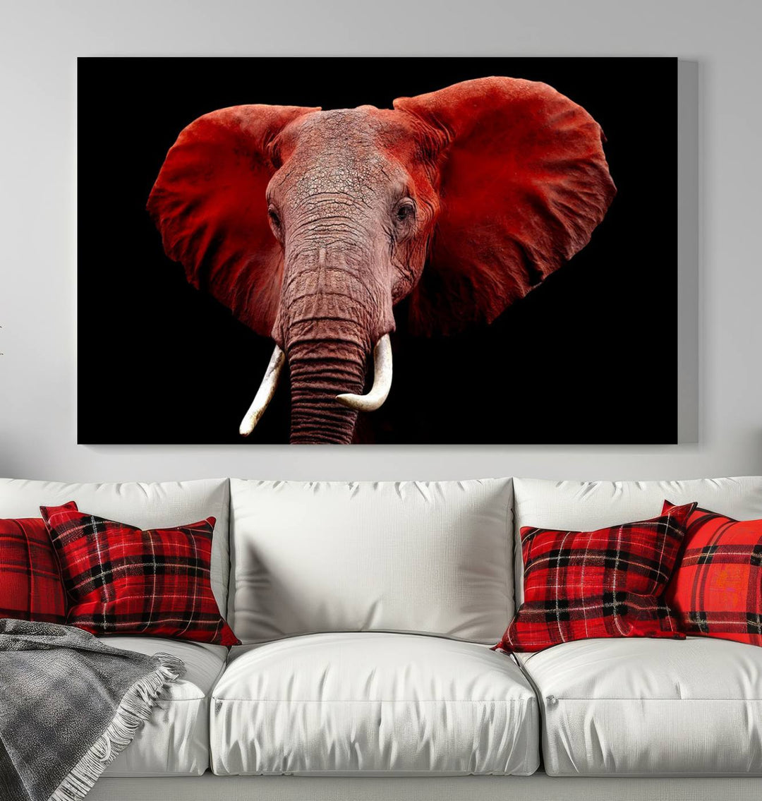 A Wall Art Canvas Print in the modern living room features a three-panel premium design of a red elephant face.