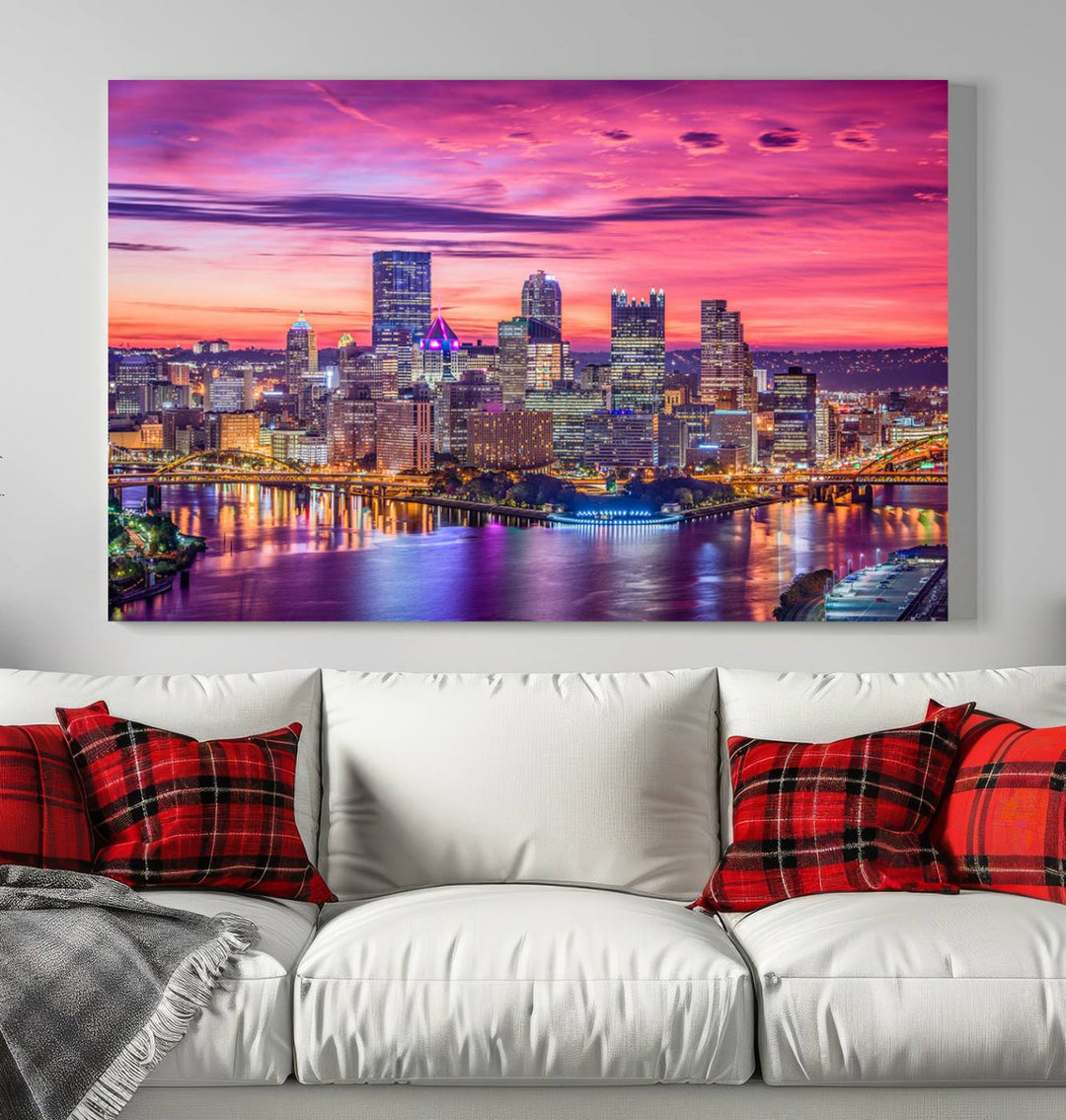 The Pittsburg Wall Art Canvas Print, showcasing a vibrant sunset glow over the city skyline and crafted by a professional artisan, adorns the space.