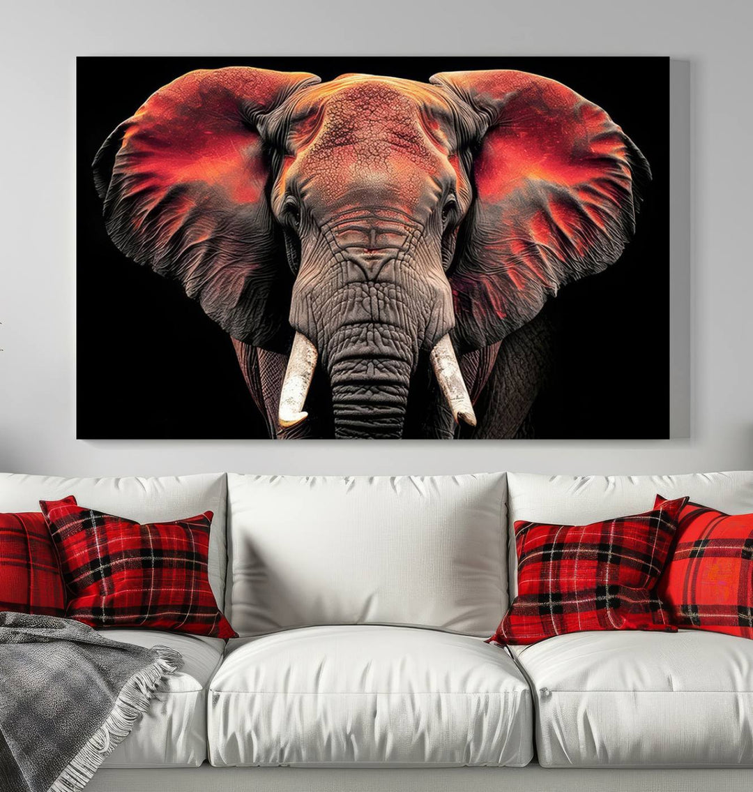 The Elephant Wall Art Canvas Print, featuring vibrant red and black tones, is a stunning artwork printed on museum-quality canvas. It comes with a UV-protective coating.