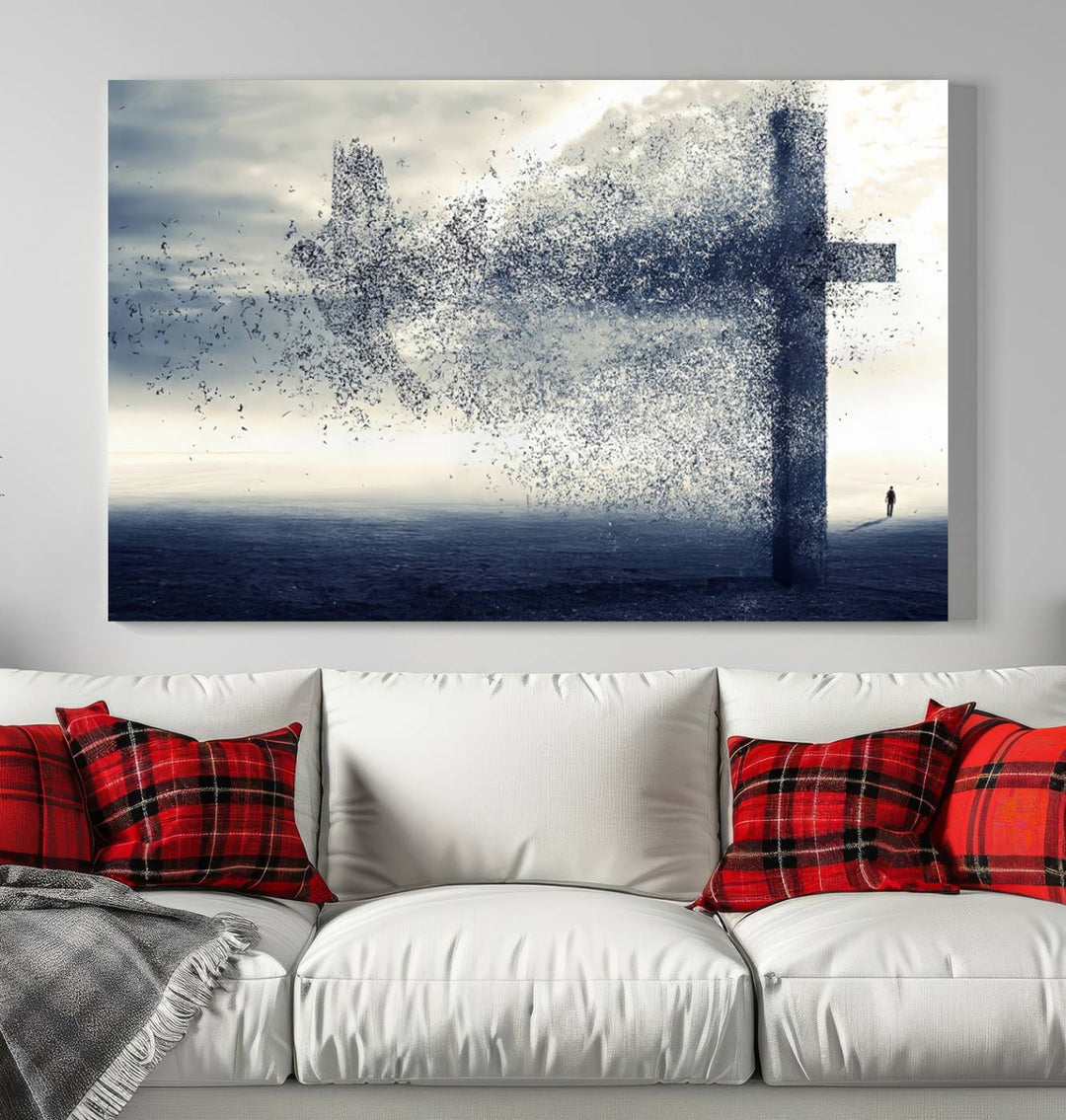 The "Jesus and the Fading Cross – Symbol of Faith" framed canvas print beautifully depicts a cross formed by birds against a moody sky above an ocean. This piece of Christian wall art infuses spirituality into the minimalist space.