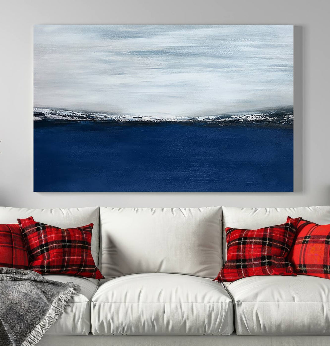 The modern living room is enhanced by the Navy Blue Abstract Wall Art Canvas Print on the wall, crafted as handmade wall art with a gallery-quality finish.