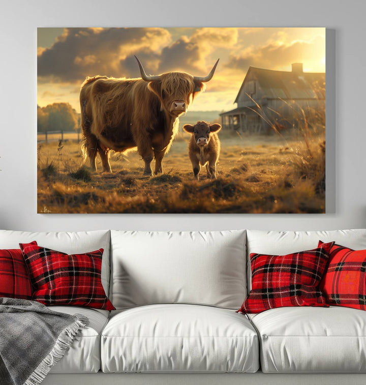 The "Highland Baby Cow Canvas Wall Art Animal Print" triptych art piece showcases a cow and calf in a sunlit field with a barn in the background.