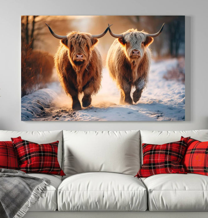 The living room showcases a triptych from the Scottish Highland Cow Horn Farm Wall Art Canvas Print collection, depicting two Highland cows running in the snow. Complementing this are handmade wall art pieces with a gallery-quality finish that add an elegant touch.