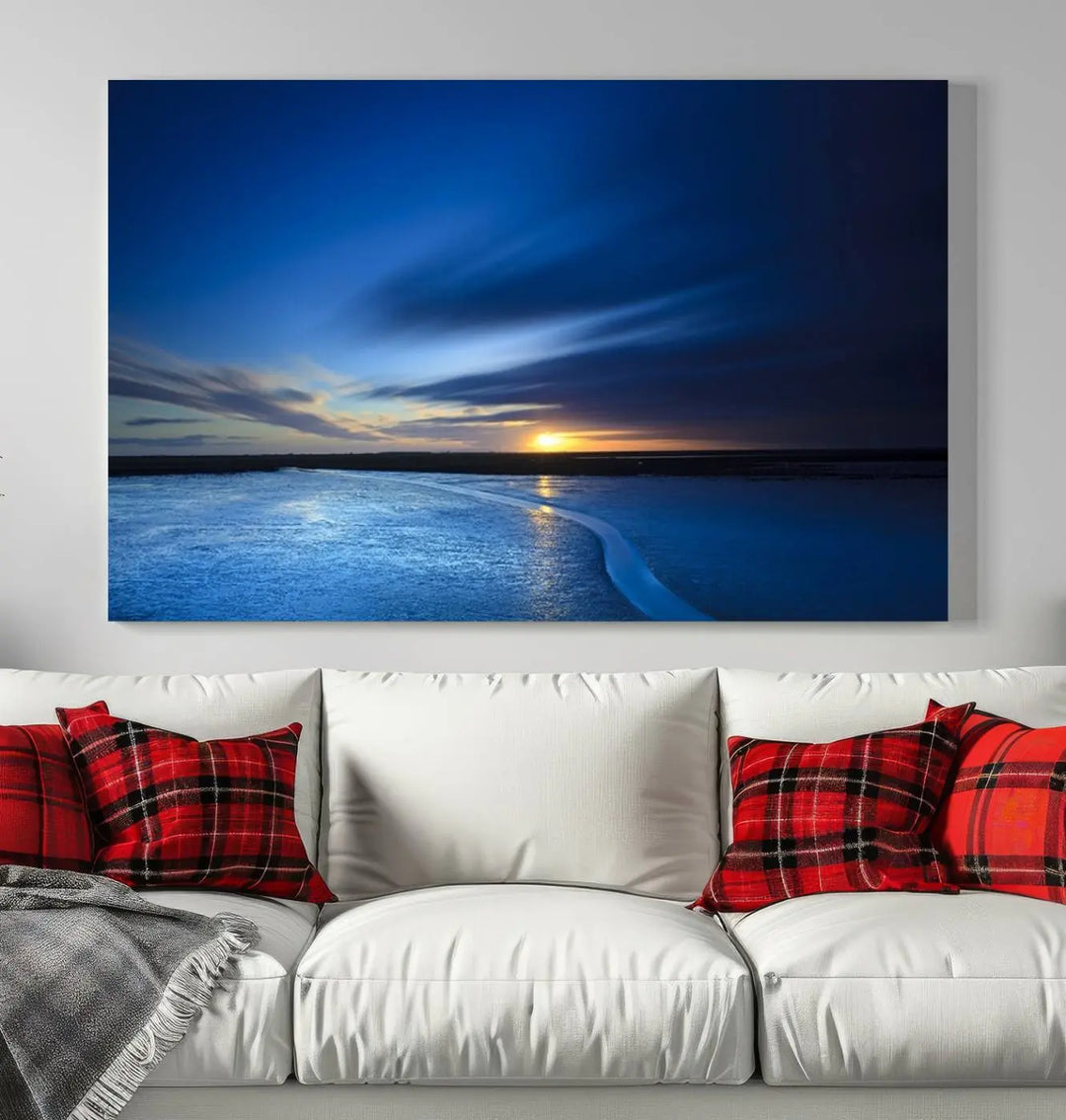 The living room features a triptych of the Wall Art Canvas Print Navy Sunset Lake Landscape Artwork, adding to its tranquil vibe.