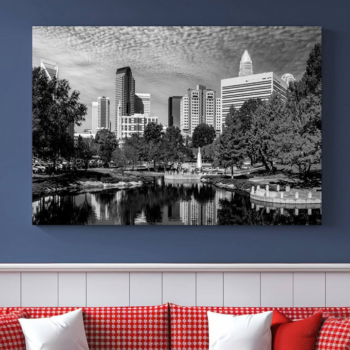 The living room features a captivating triptych titled "Charlotte City Cloudy Skyline Black and White Wall Art Cityscape Canvas Print," crafted on museum-quality canvas with UV-protective coating. Modern decor accentuates the dynamic scene.