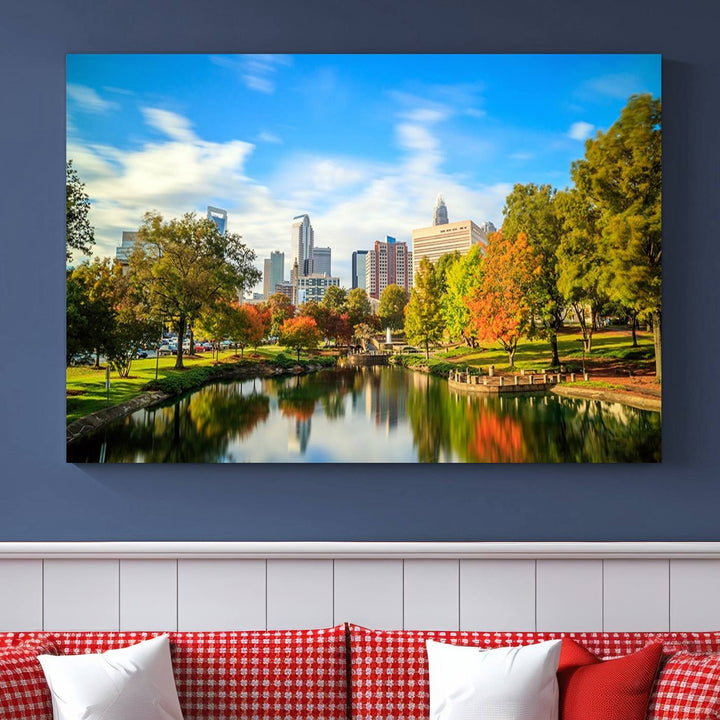 The Charlotte City Park at Spring Skyline Cityscape View wall art canvas print is a triptych featuring a scenic park with a lake and city skyline. It is gallery-wrapped on museum-quality canvases.