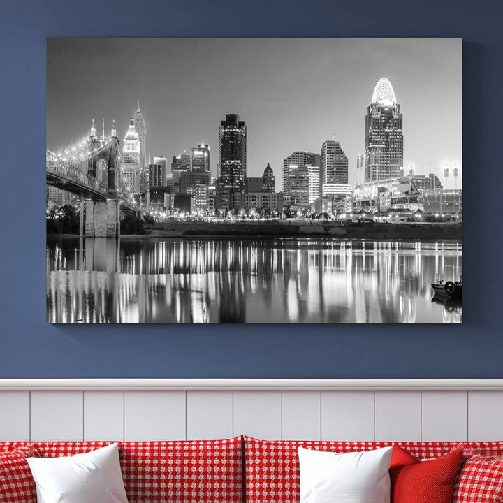 The "Cincinnati City Lights Skyline Black and White Wall Art Cityscape Canvas Print" is elegantly displayed in a stylish living room.