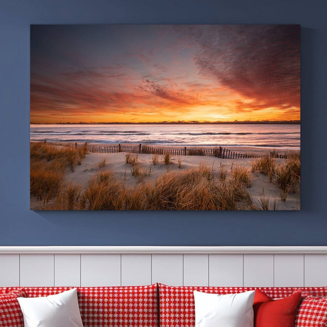 Sunset on The Beach Wall Art Canvas Print features a triptych of a beach at sunset with vivid orange skies, presented on museum-quality canvas. Each section is gallery wrapped, offering lasting beauty with its UV-protective coating.