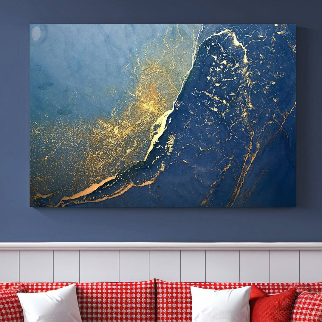 The Navy Blue Yellow Twinkle Wall Art Canvas Print, featuring an abstract design in gold and blue, enhances a modern living room as it adorns a white wall with its gallery-wrapped, museum-quality canvases for an exquisite touch.