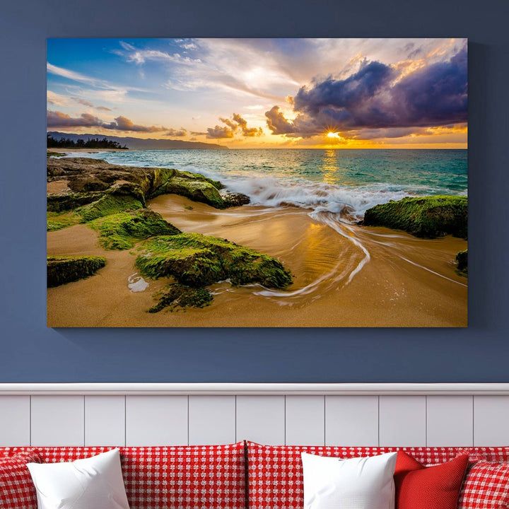 The Sunset Beach Wall Art Canvas Print is a gallery-wrapped triptych showcasing a beach scene with mossy rocks and a vibrant sunset. Made from museum-quality canvas and featuring a UV-protective coating, it elegantly provides both beauty and durability.