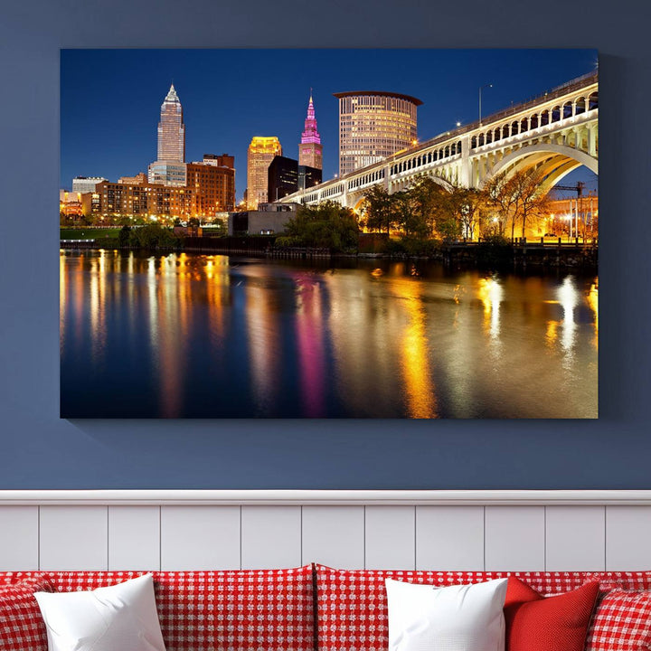 The "Cleveland Night Skyline Wall Art City Cityscape Canvas Print" is a striking feature in the room, showcasing a city skyline with a bridge reflecting in a river. Displayed on museum-quality canvas, it offers enduring beauty.