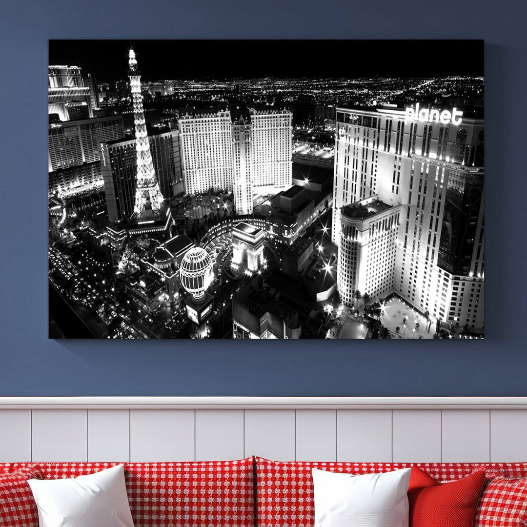 The Las Vegas Wall Art Canvas Print is a black and white triptych that showcases a city skyline at night. Crafted on museum-quality canvas with a UV-protective coating, it serves as an elegant and ready-to-hang focal point in the room.