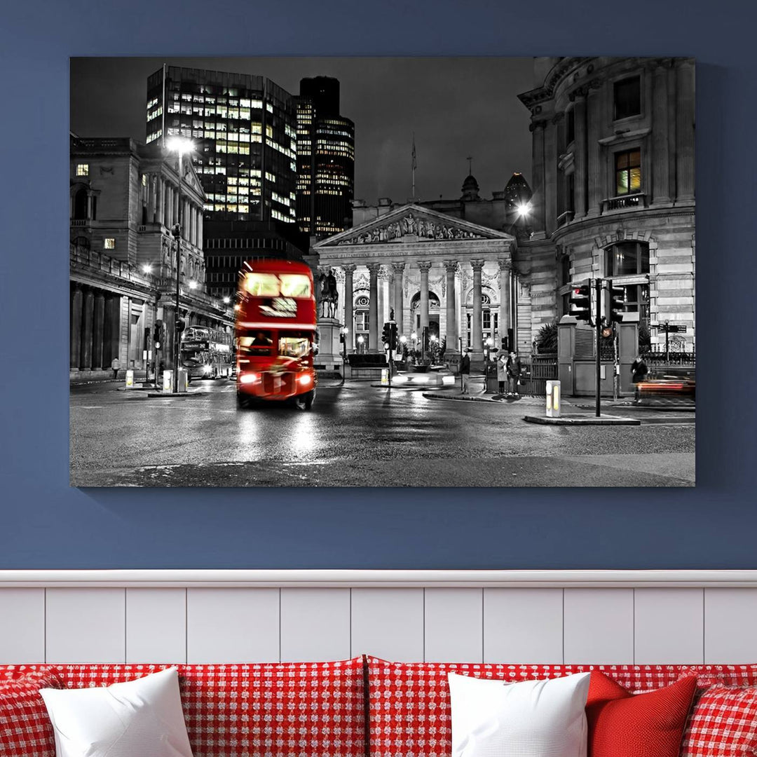 The London Night Red Bus Wall Art Canvas Print features a black and white cityscape with a moving red double-decker bus, crafted on museum-quality canvas with a UV-protective coating. This ready-to-hang artwork is designed to stand out and enhance any space.