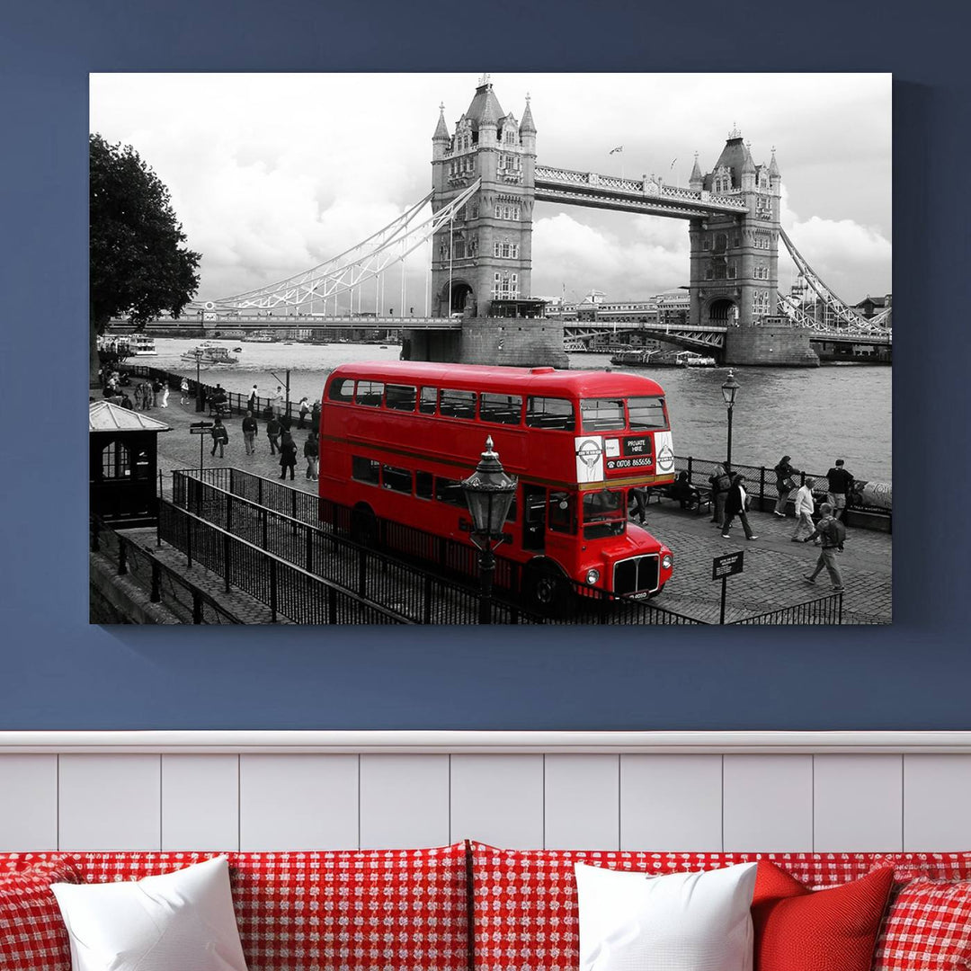 The London Red Bus and Bridge Wall Art Canvas Print showcases a red London bus in front of Tower Bridge, beautifully presented as a gallery-wrapped canvas. This striking image is divided into three panels, delivering a museum-quality display that's ready to hang.