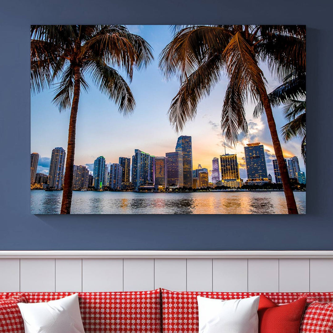 The Wall Art MIAMI Canvas Print features a triptych design depicting palm trees and a city skyline at sunset.