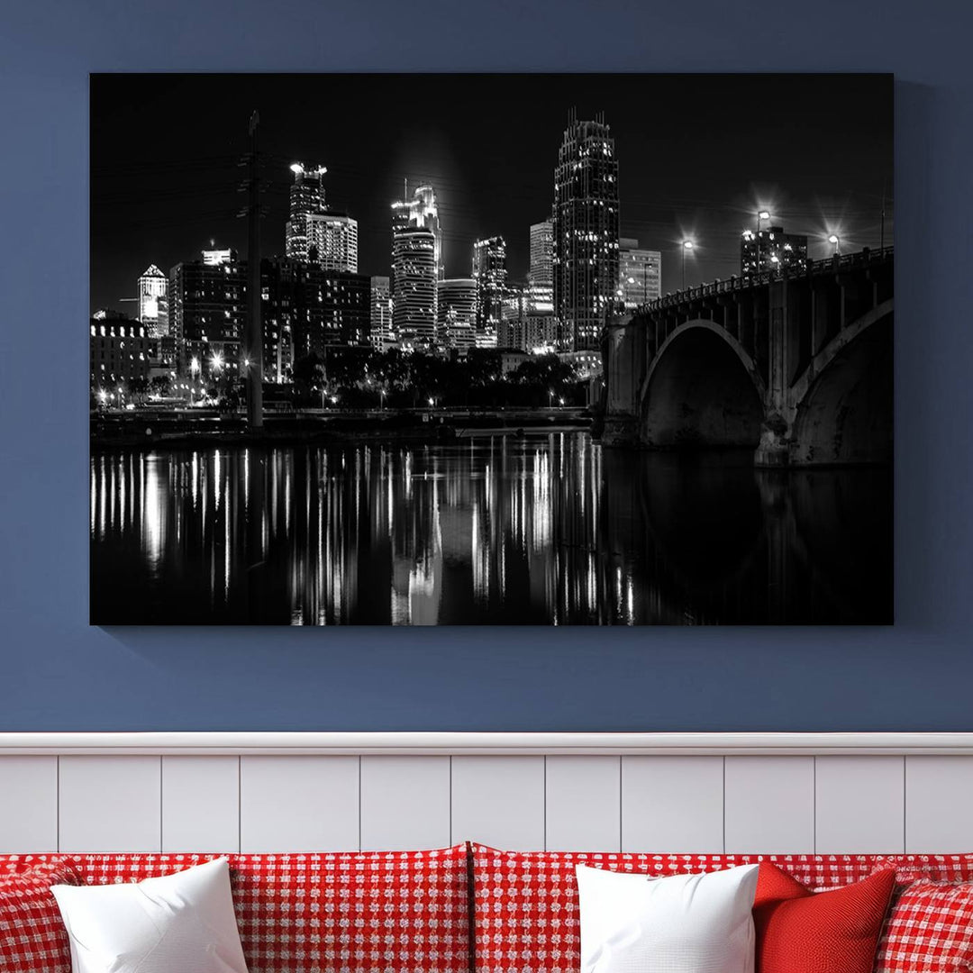 The "Minneapolis Wall Art Canvas Print, Minnesota City Wall Art Print, Minnesota Cityscapes Wall Art" features a black and white triptych of a city skyline with a bridge. Crafted on museum-quality canvas, this gallery-wrapped artwork is finished with a UV-protective coating to ensure lasting beauty.