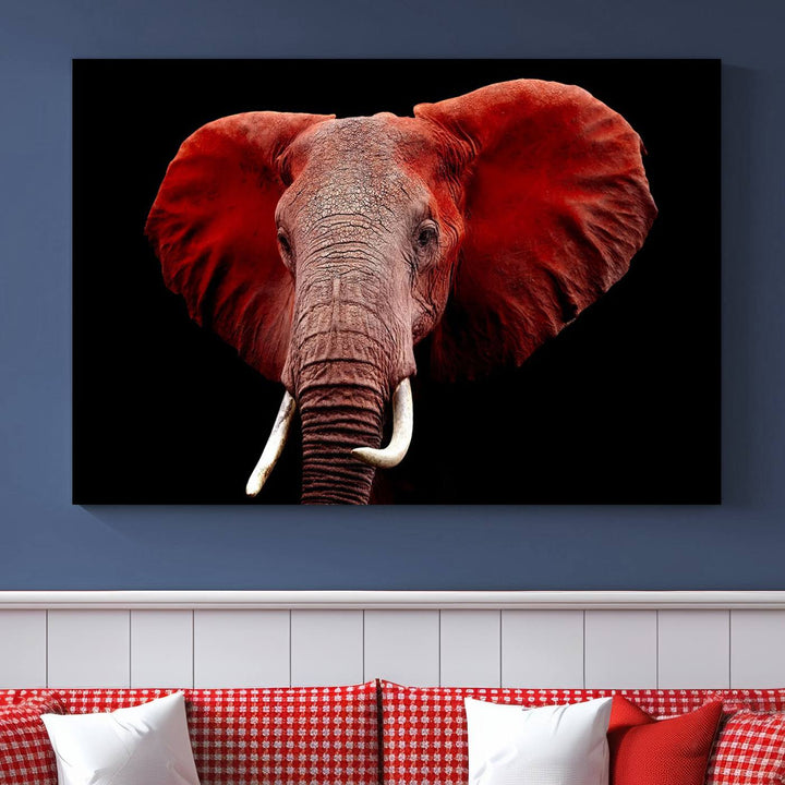 A Wall Art Canvas Print in the modern living room features a three-panel premium design of a red elephant face.