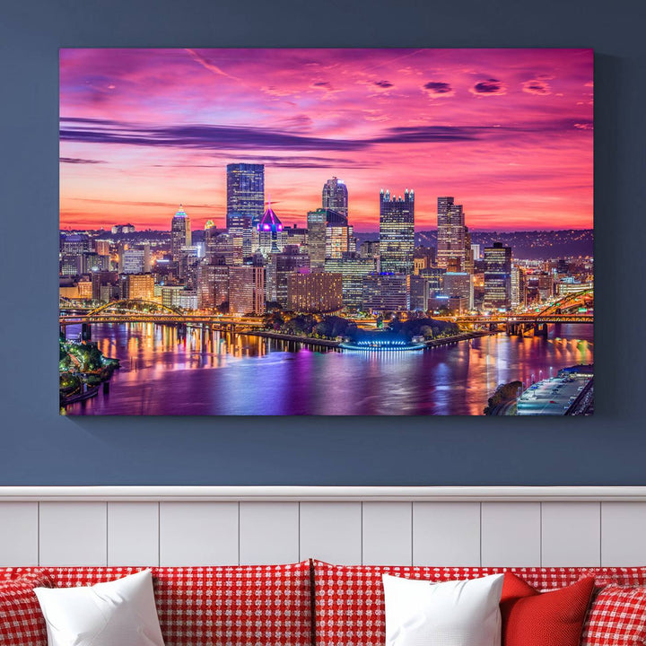 The Pittsburg Wall Art Canvas Print, showcasing a vibrant sunset glow over the city skyline and crafted by a professional artisan, adorns the space.