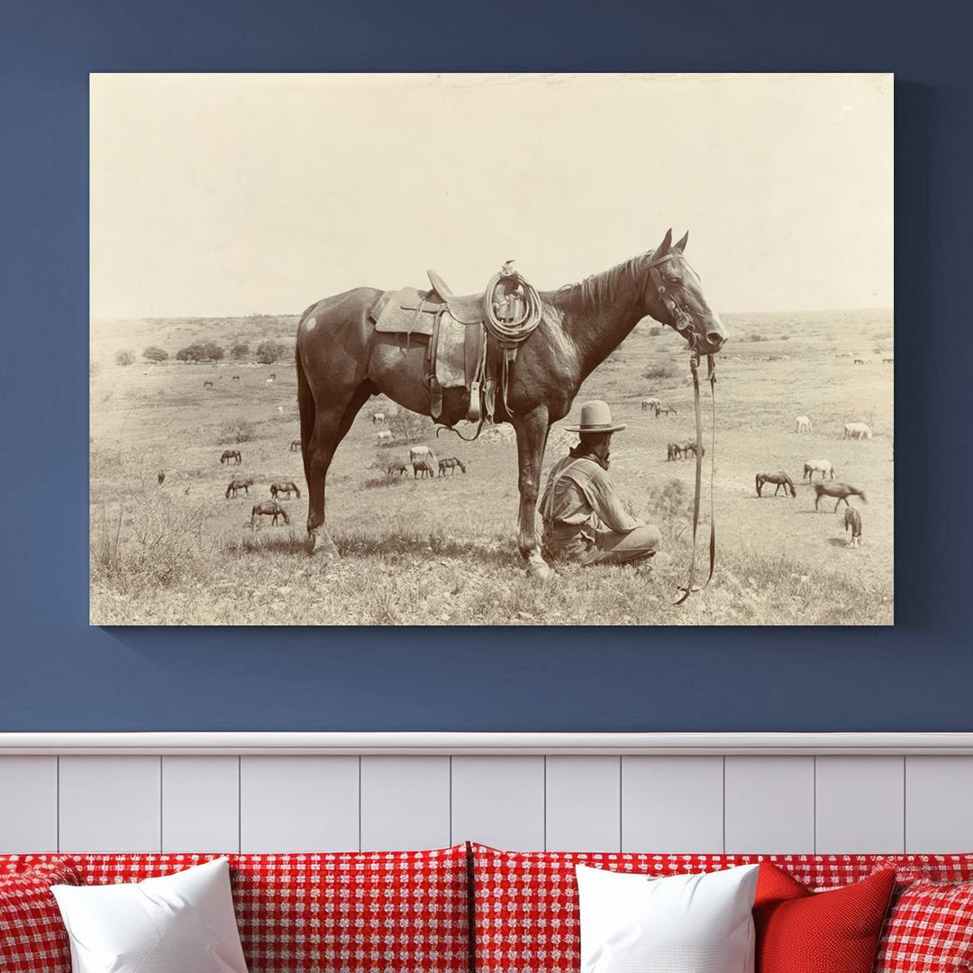 The "Serene Cowboy and Horse Resting on the Prairie" canvas print beautifully captures the essence of the American West, featuring a vintage cowboy resting under his horse in a grassy field with grazing cattle. This ready-to-hang western wall art adds a touch of nostalgia to any space.