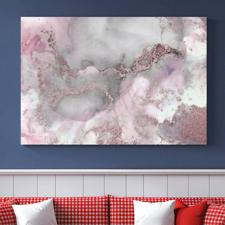 The Rose Marble Abstract Wall Art Canvas Print is a stunning triptych that showcases pink and gray tones, elegantly presented on a dark wall.