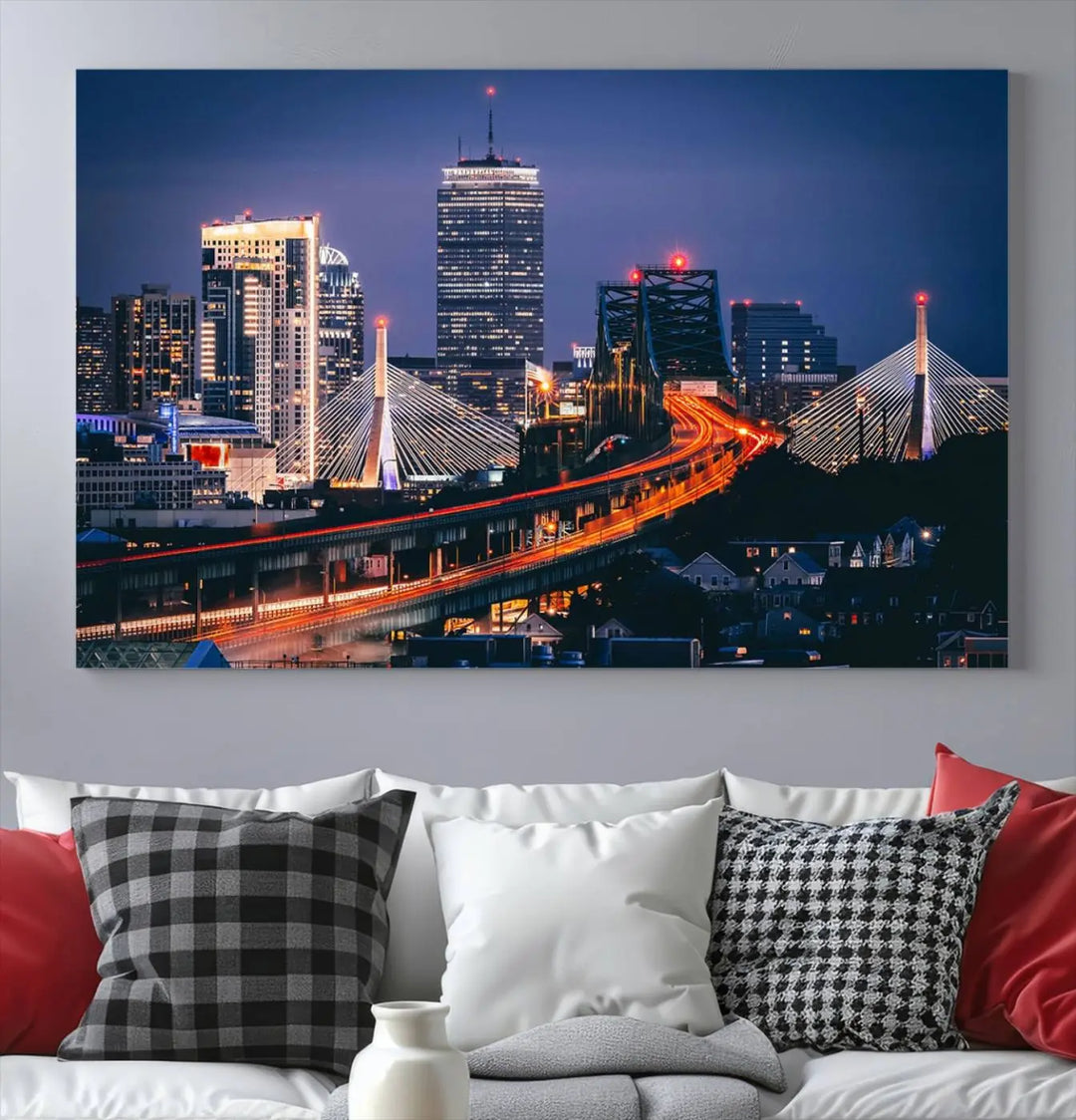 The "Boston City Lights Night Skyline Cityscape View" artwork on the wall showcases a brightly lit bridge at night. It is displayed on museum-quality canvas with a UV-protective coating.