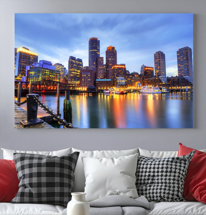 The Boston City Lights Sunset Cloudy Blue Skyline Cityscape View Wall Art Canvas Print embellishes a contemporary living room. This gallery-wrapped canvas set guarantees museum-quality canvases to enhance any space.