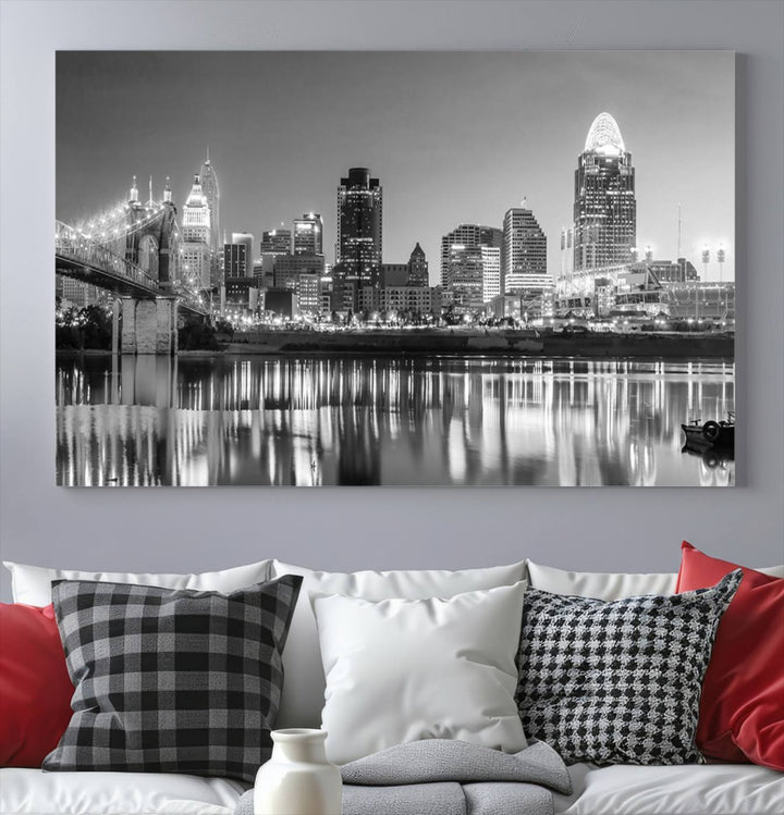 The "Cincinnati City Lights Skyline Black and White Wall Art Cityscape Canvas Print" is elegantly displayed in a stylish living room.