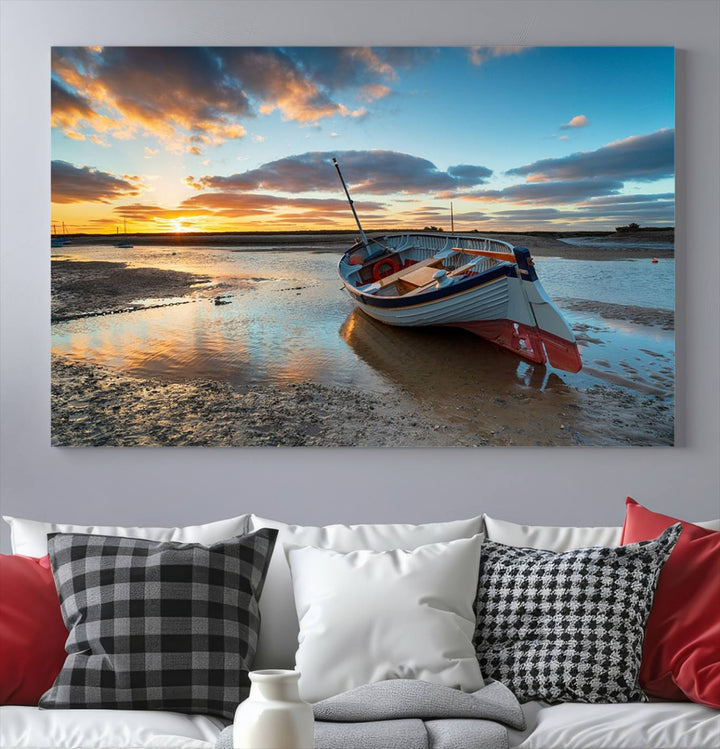 The "Small Boat At The Beach Sunset Wall Art Canvas Print," a three-panel masterpiece crafted on museum-quality canvas, hangs elegantly.