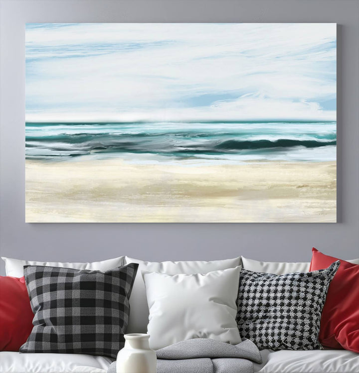 The room features the Ocean Abstract Wall Art Canvas Print, a triptych beach painting on museum-quality canvas with a gallery-wrapped finish and UV-protective coating.