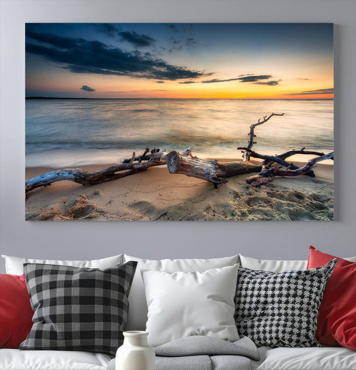 A captivating piece of Ocean Sunset Beach Wall Art Canvas Print, gallery wrapped, graces the gray wall.