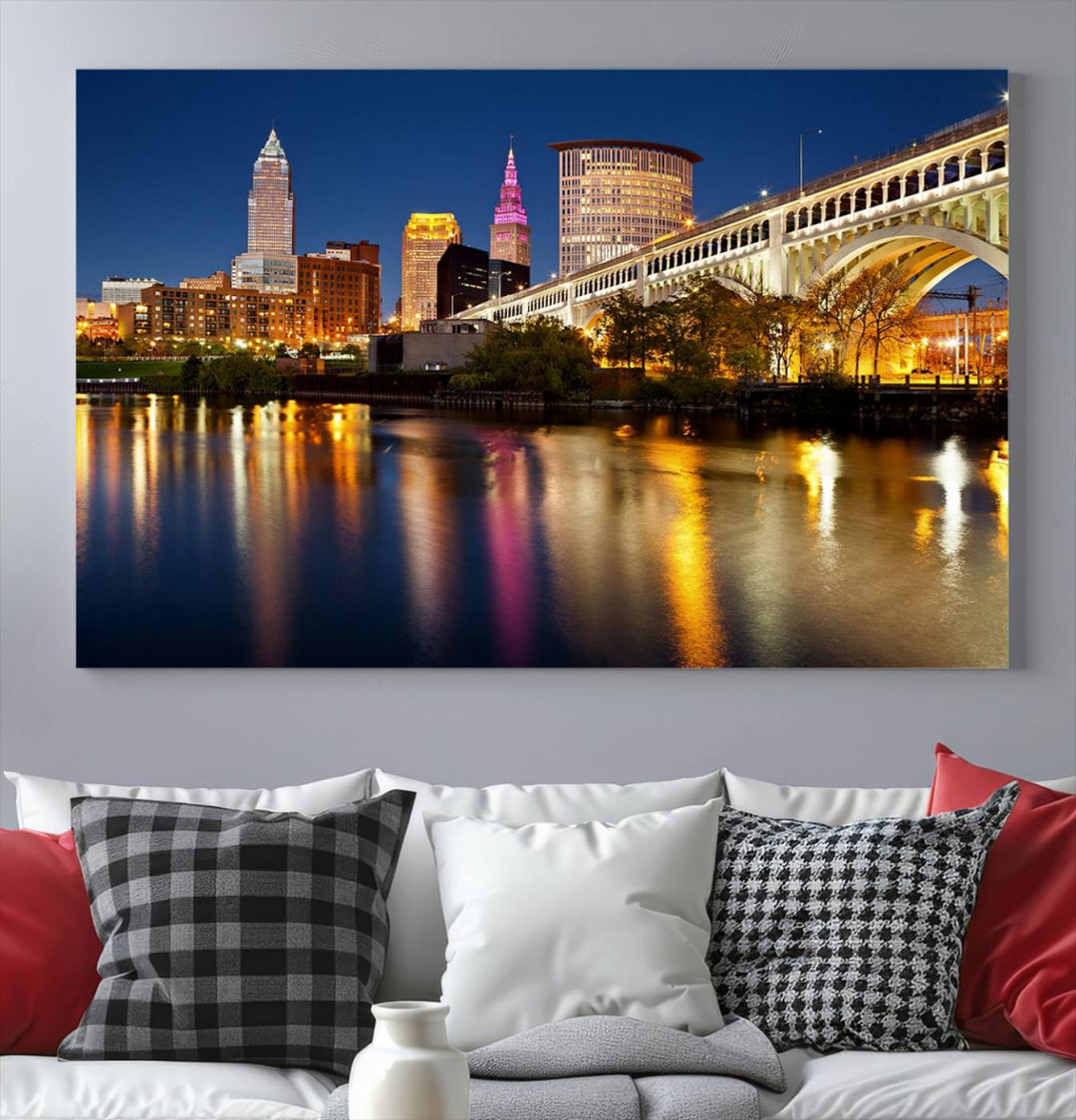 The "Cleveland Night Skyline Wall Art City Cityscape Canvas Print" is a striking feature in the room, showcasing a city skyline with a bridge reflecting in a river. Displayed on museum-quality canvas, it offers enduring beauty.