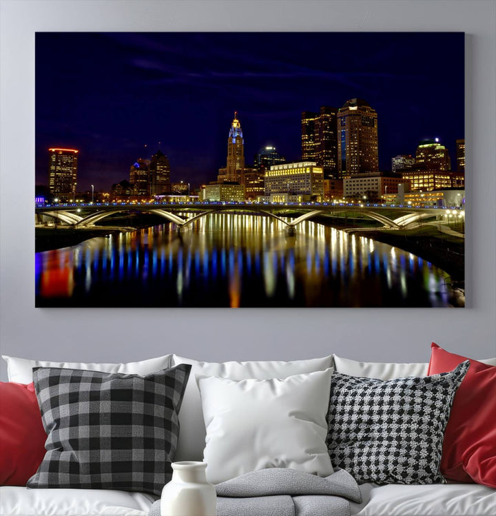 The "Columbus City Lights Night Skyline Cityscape View Wall Art Canvas Print" showcases a stunning city skyline at night, with illuminated buildings and bridges reflecting in the river, on a museum-quality canvas ready to hang.