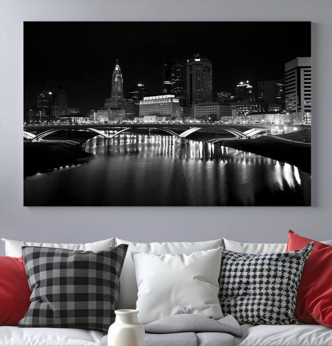 The living room features the "Columbus City Lights Skyline Black and White Wall Art Cityscape Canvas Print" above a coffee table. This artwork is presented as a triptych on museum-quality canvases with UV-protective coating.