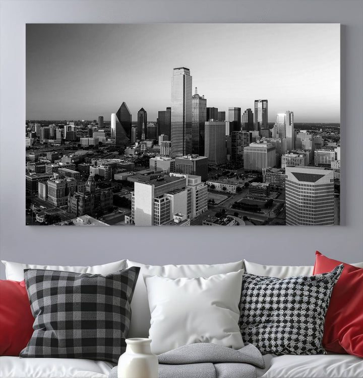 A modern living room showcases the Dallas City Lights Skyline Black and White Wall Art Cityscape Canvas Print. This gallery-wrapped piece offers a sleek finish and is crafted from museum-quality pollycotton. It features a UV-protective coating to ensure lasting vibrancy.