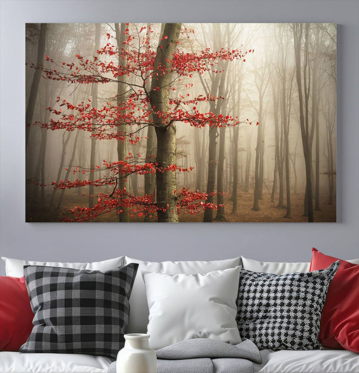 The living room features the Foggy Forest Wall Art, an Autumn Trees Canvas Print that showcases a serene nature scene with foggy woodland decor and a tree adorned in vibrant red leaves.