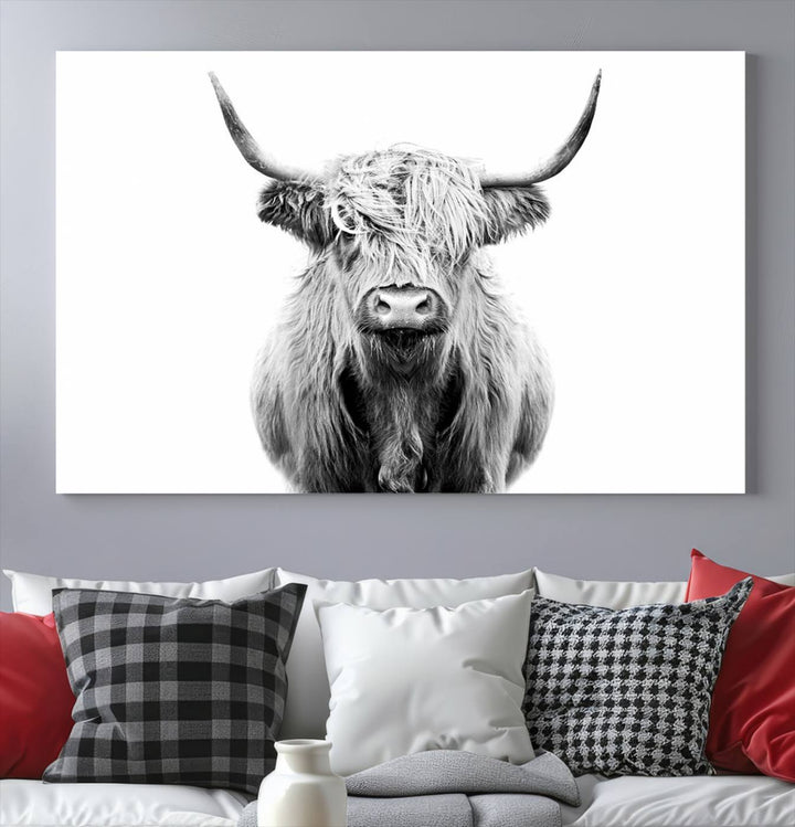 The wall art features a triptych of a Scottish Highland cow, printed on museum-quality canvases with a UV-protective coating. This decorative piece is known as the Highland Cow Canvas Wall Art Farm House Wall Art.