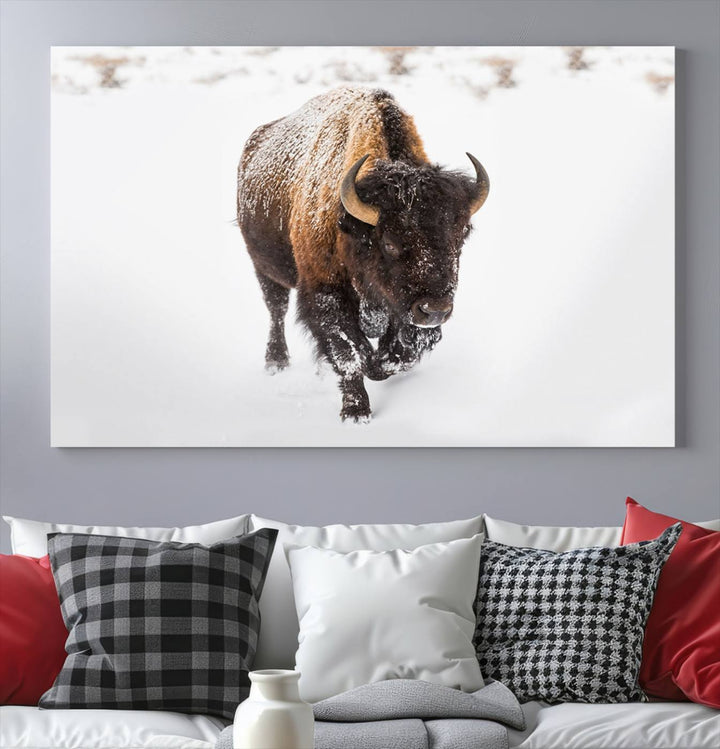 The Bison Winter Wall Art Canvas Print for Farmhouse Decor is displayed as a triptych in the living room. This artwork, printed on museum-quality canvases with a UV-protective coating to maintain its vibrant colors, is the focal point of the space.