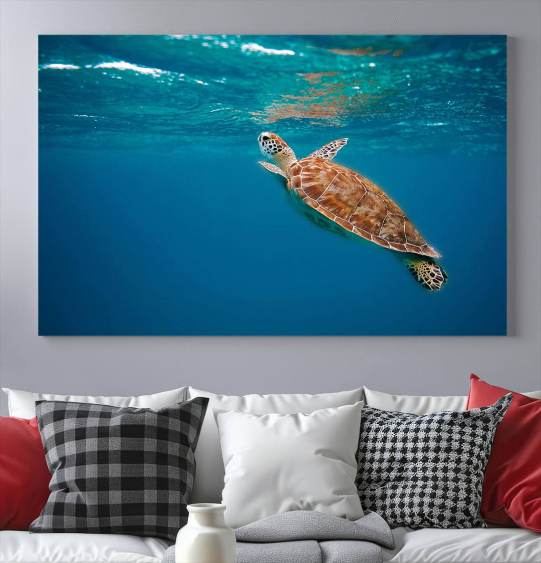 The living room features the "Baby Turtle in Ocean" wall art canvas print. This gallery-quality piece, depicting a sea turtle swimming underwater, adds an elegant touch to the space.