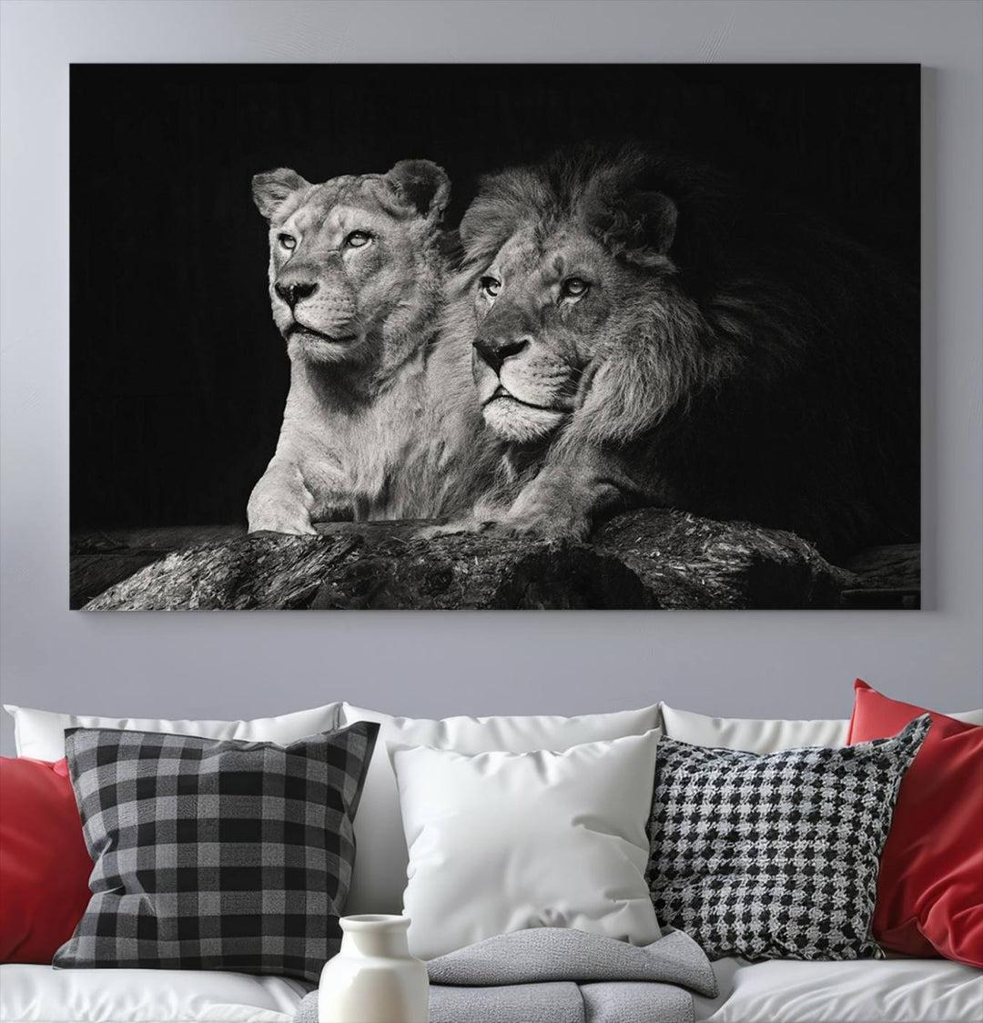 The elegant wildlife portrait, "Lion Couple Canvas Wall Art Print," featuring a black and white depiction of a lion family, majestically decorates the living room wall.