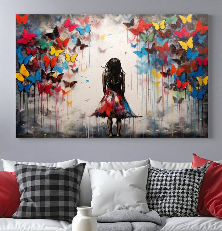 The Girl Butterfly Graffiti Abstract Canvas Print, featuring a vibrant depiction of a girl surrounded by butterflies on museum-quality canvas, is displayed prominently.