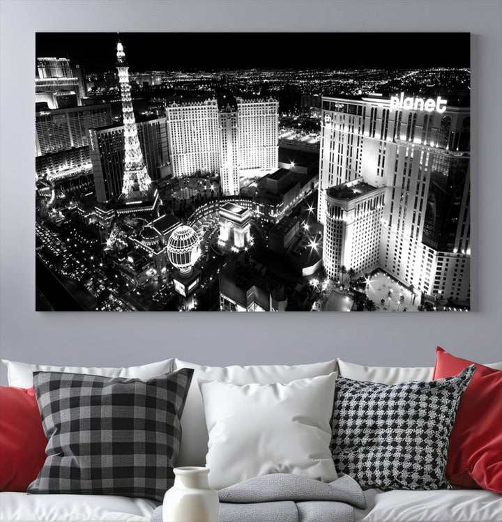 The Las Vegas Wall Art Canvas Print is a black and white triptych that showcases a city skyline at night. Crafted on museum-quality canvas with a UV-protective coating, it serves as an elegant and ready-to-hang focal point in the room.