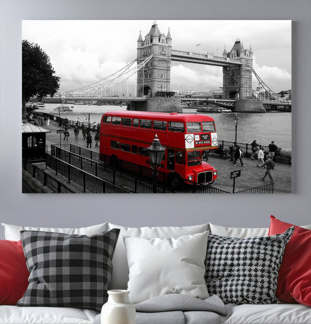 The London Red Bus and Bridge Wall Art Canvas Print showcases a red London bus in front of Tower Bridge, beautifully presented as a gallery-wrapped canvas. This striking image is divided into three panels, delivering a museum-quality display that's ready to hang.