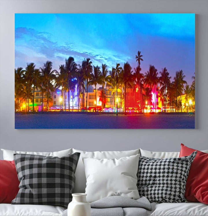 The living room features a three-panel Miami City Wall Art Canvas Print, showcasing a colorful, illuminated beach scene with palm trees on museum-quality canvas.