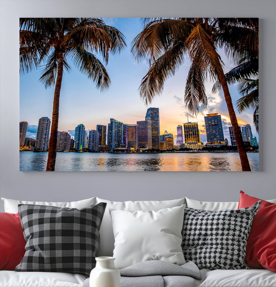 The Wall Art MIAMI Canvas Print features a triptych design depicting palm trees and a city skyline at sunset.